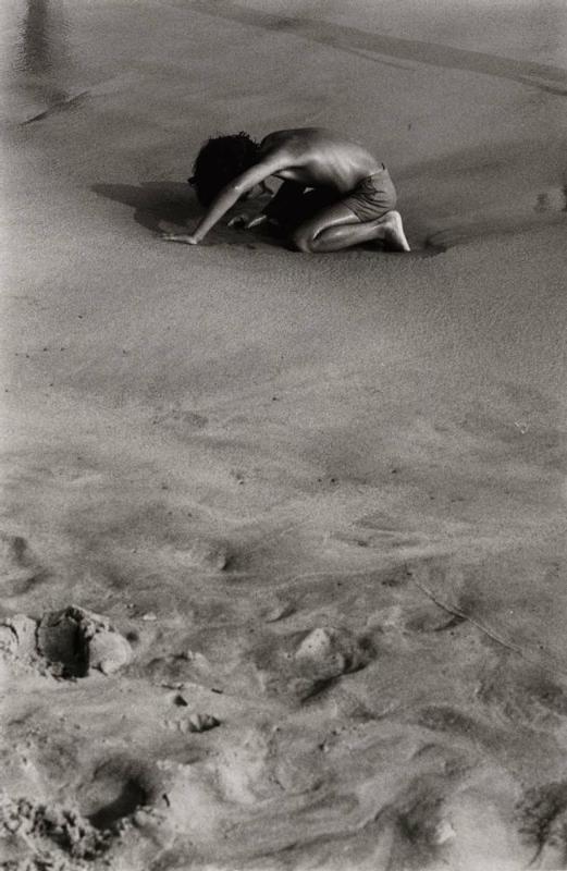 USA Provincetown (boy crouched on beach)