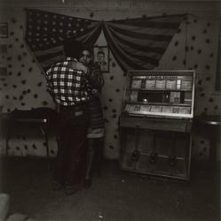 Untitled, [Couple Dancing in front of Jukebox with Flag and JFK], from East 100th Street series