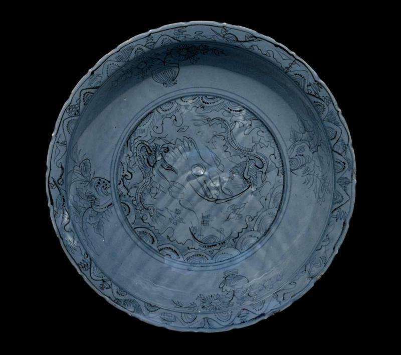 Large, deep plate with blue-and-white decoration of dragon and phoenix under blue glaze