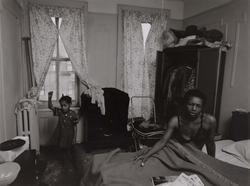 Untitled, [Child Singing with Woman on Bed], from East 100th Street series
