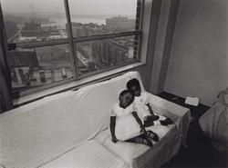 Untitled, [Children on Couch with East 100th Street Out the Window], from East 100th Street series