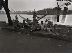 Untitled, [Family Gathering on Wards Island – East 100th Street in the Background], from East 100th Street series