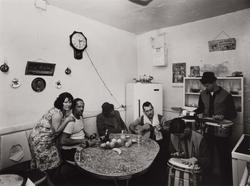 Untitled, [Family in Kitchen with Clock on Wall], from East 100th Street series