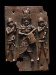 Relief plaque showing a dignitary with drum and two attendants striking gongs