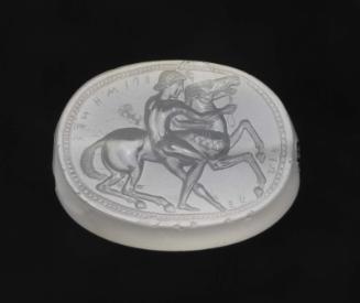 Scaraboid gem with a nude youth and a horse