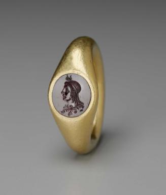Ring with round gem with bust of Isis
