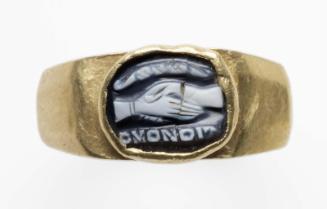 Ring with cameo of clasped hands