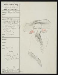 Female model, hand resting on chin, in broad-brimmed hat with brown and white dotted fabric 