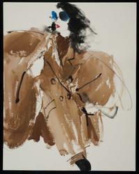 Female model in brown poncho with blue glasses