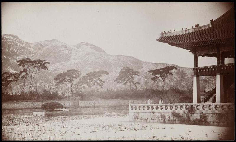 A corner of the Summer Palace [Gyeonghoeru Pavilion] with lotus pond - City wall can be seen on the summit of the mountain in the distance  (NRICP Relic No.: 2869)
