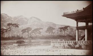 A corner of the Summer Palace [Gyeonghoeru Pavilion] with lotus pond - City wall can be seen on the summit of the mountain in the distance  (NRICP Relic No.: 2869)