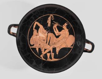 Drinking cup (kylix) depicting a symposium