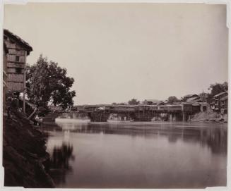 Riverbank with Humble Dwellings