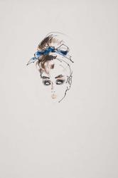 Female model with makeup and blue bow 
