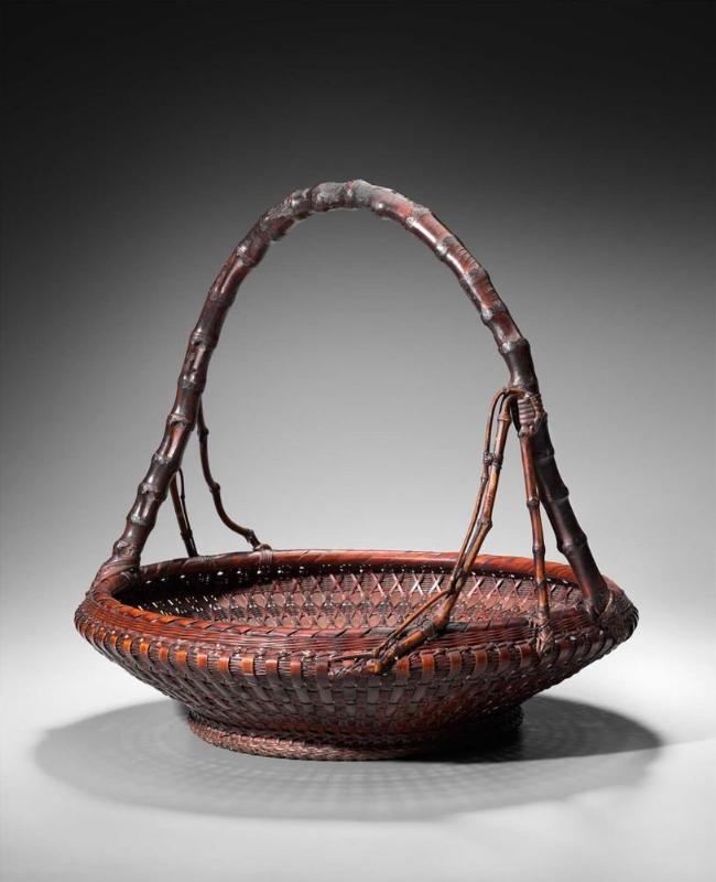 Basket with bamboo-root handle