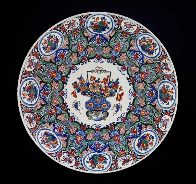 One of a pair of chargers with basket of flowers