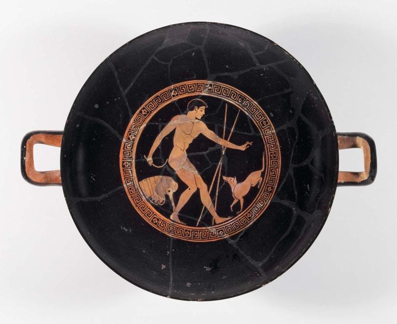Drinking cup (kylix) depicting an athlete cleaning up and his dog