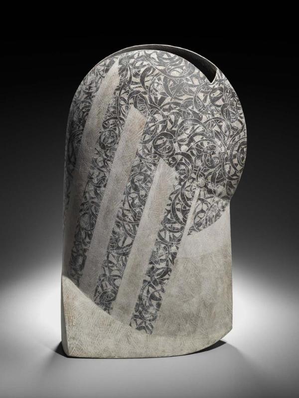 Vessel with decoration of curvilinear patterns