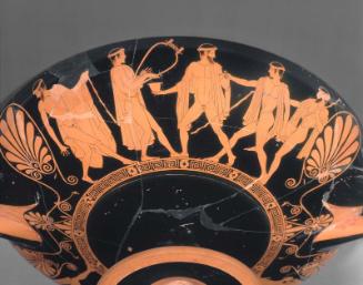 Drinking cup (kylix) with symposium and komos scenes