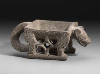 Feline effigy metate