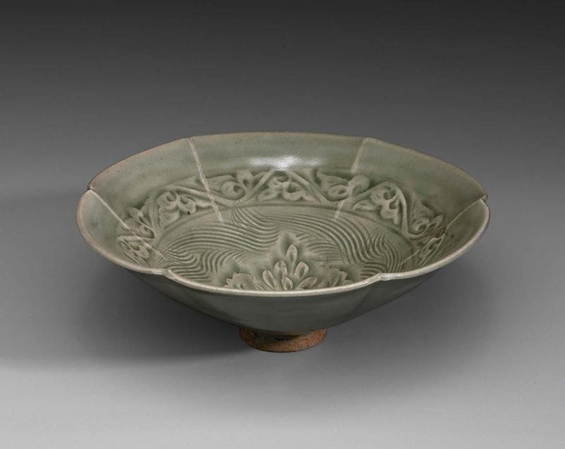 Six-lobed shallow bowl decorated with carved and molded designs under celadon glaze