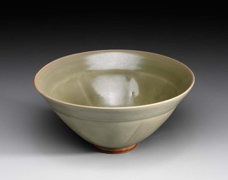 Large conical bowl with five vertical gores decorated with celadon glaze