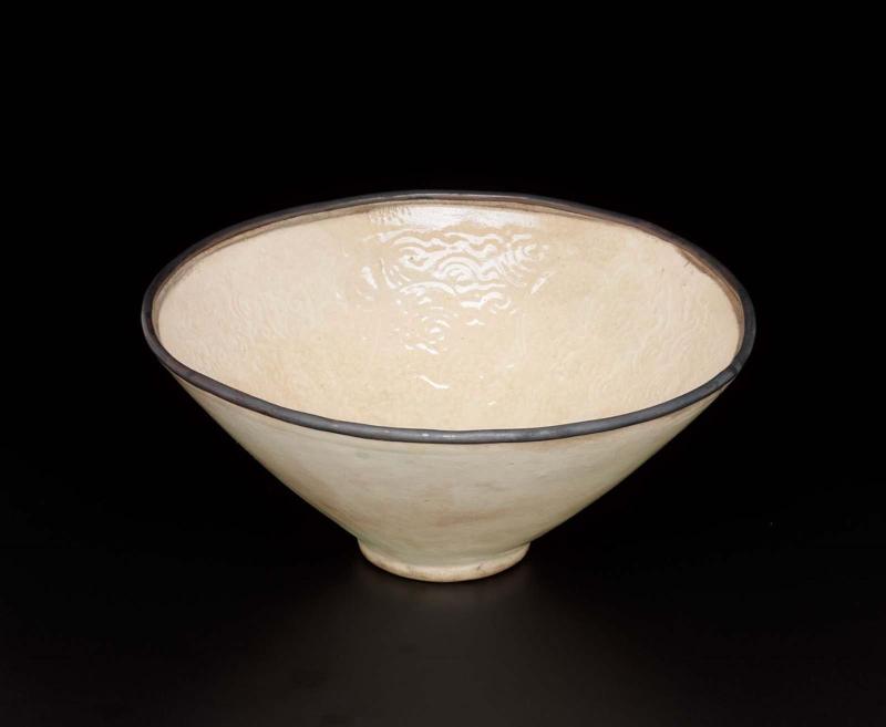 Conical bowl with molded floral design and metal rim