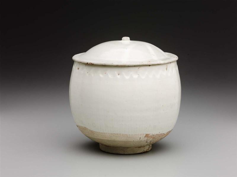 Deep covered bowl with combed pattern under glaze