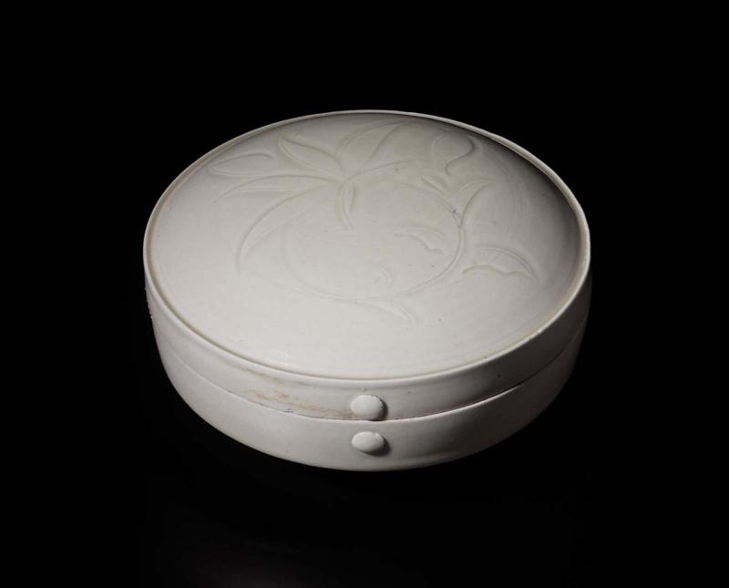 Covered box with floral design