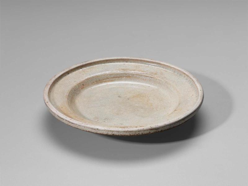 Plate decorated with white glaze