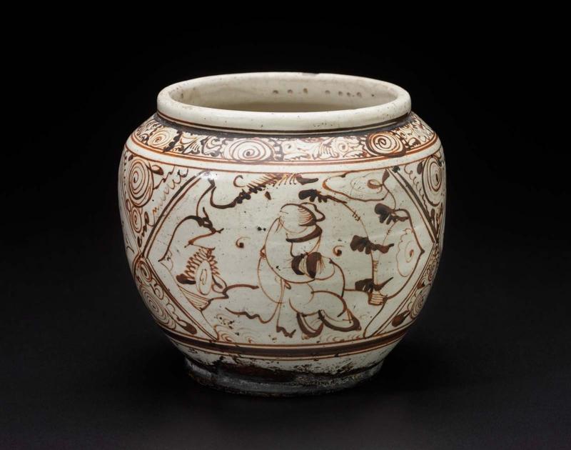 Small jar with painted slip decoration of crane and human figures in ogival windows