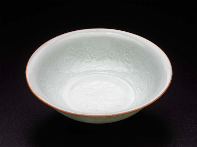 Molded bowl with relief designs under qingbai glaze