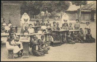From cannibalism to civilisation; A girls class at Boma, Belgian Congo.