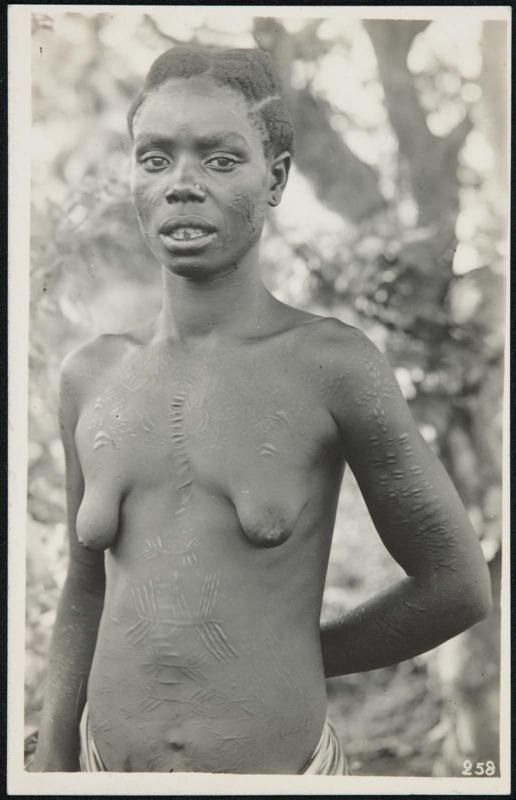 Half-length portrait of a woman with body scars