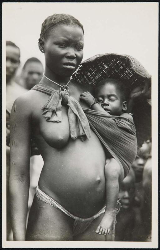 Half-length portrait of a mother with her baby in a sling