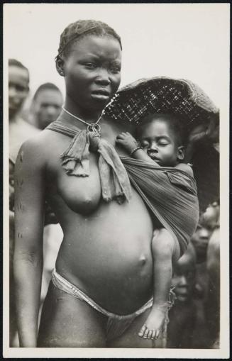 Half-length portrait of a mother with her baby in a sling