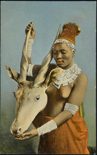 Woman holding the head of an antelope.