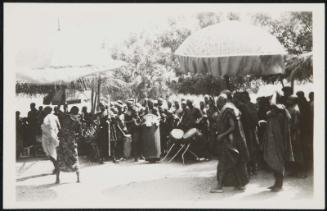 AFRICA - Tribal musicians play a rhythmic music, pulsing with their inherent rhytham and off-key tones.