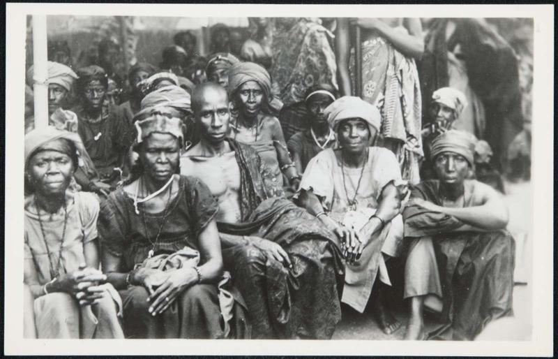 AFRICA - Dressed in their native best the villagers assemble to see the chiefs and enjoy the parade of royalty.