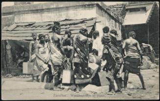 Zanzibar. Watercarriers at pipes