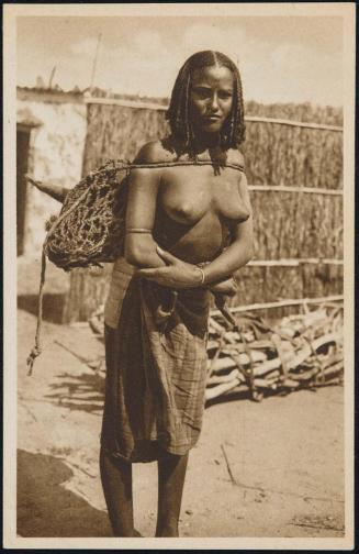 Young woman carrying a large bag