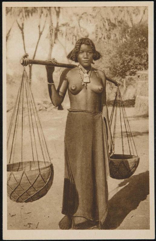 Young girl carrying water containers