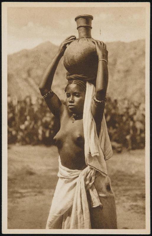 Young woman holding water container above her head