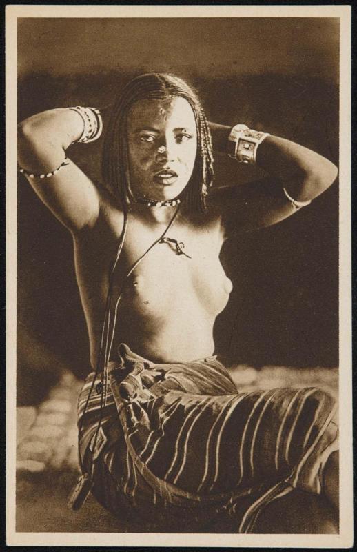 Young woman holding her hands behind her head