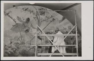Mucha working on a mural painting