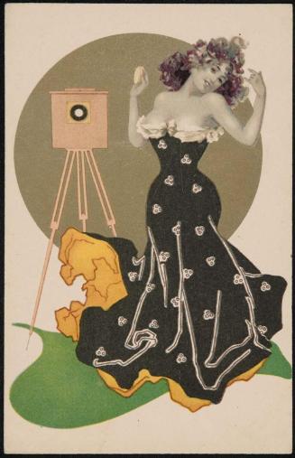 Woman in a black dress getting ready for the camera