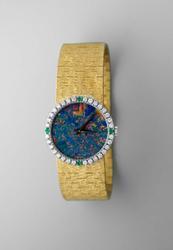 Gold wristwatch with black opal watch face