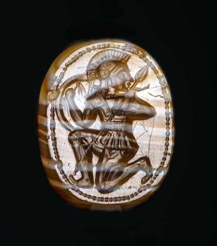 Pseudo-scarab with a running warrior and a siren on the back