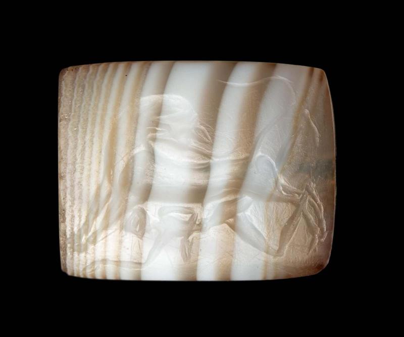 Flattened cylinder seal with a bull trampling a man