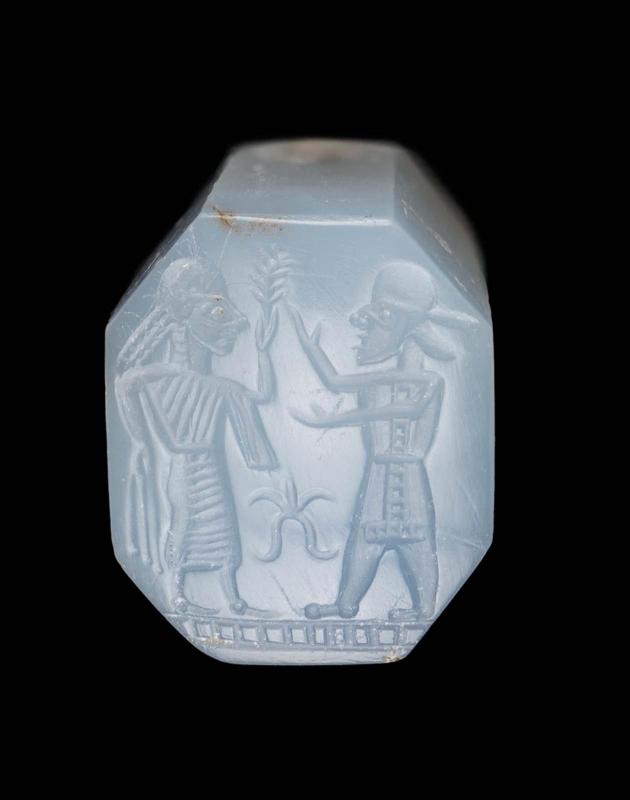 Pyramidal seal with standing man and woman